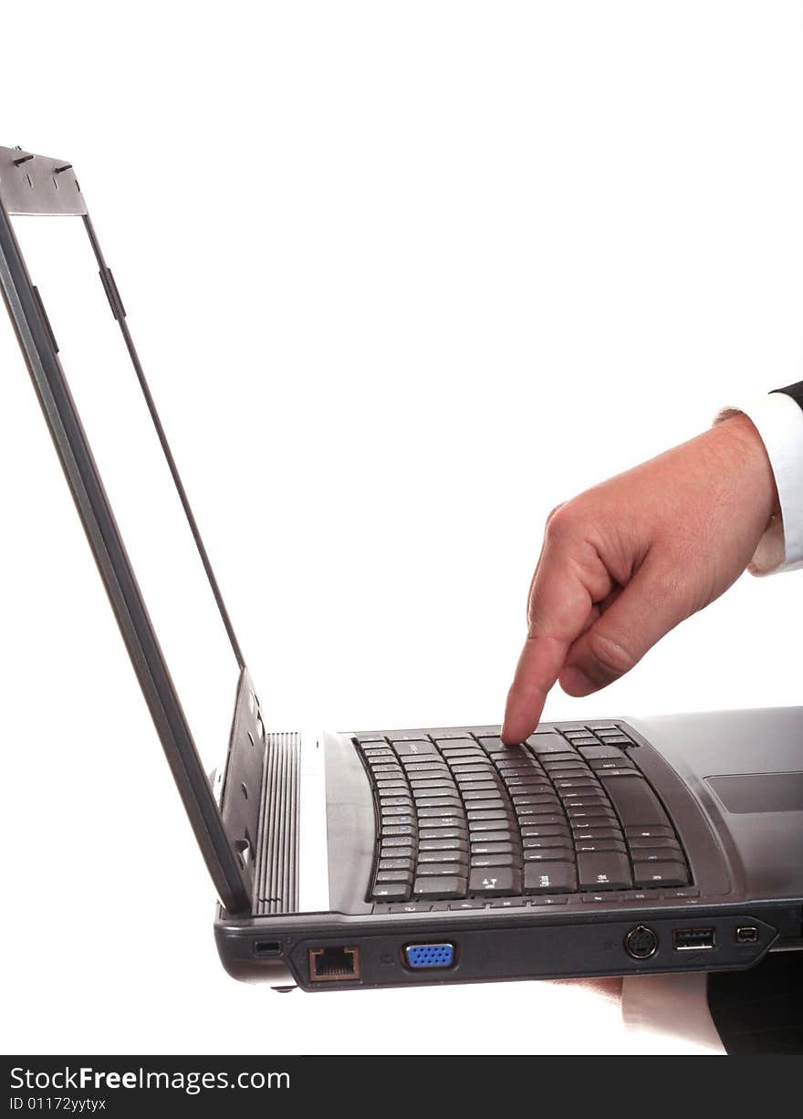 Man's hand on a laptop isolated on white