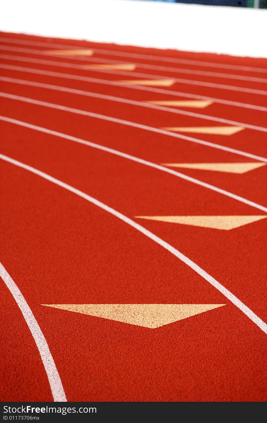 A blue track at a High School. A blue track at a High School