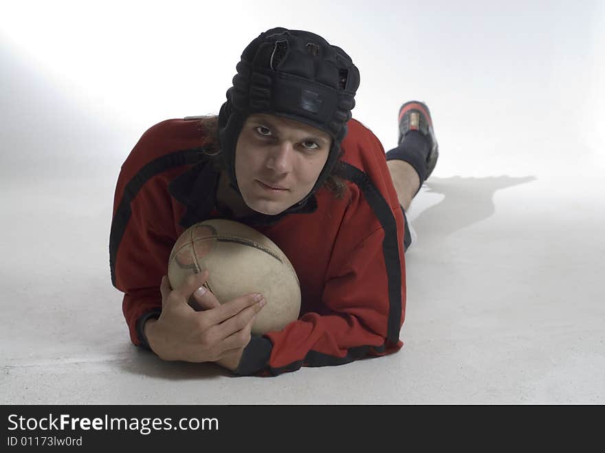 Man Holding a Football - Horizontal