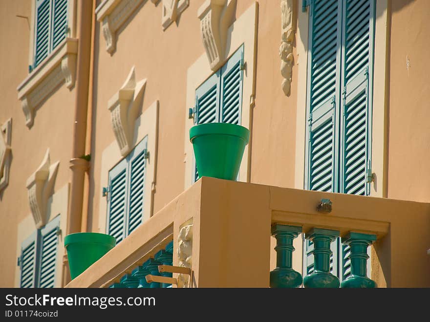 Green flowerpots standing on a sill