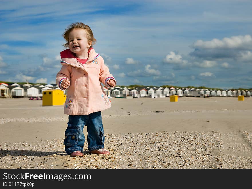 Cute young girl having fun on the beach. Cute young girl having fun on the beach