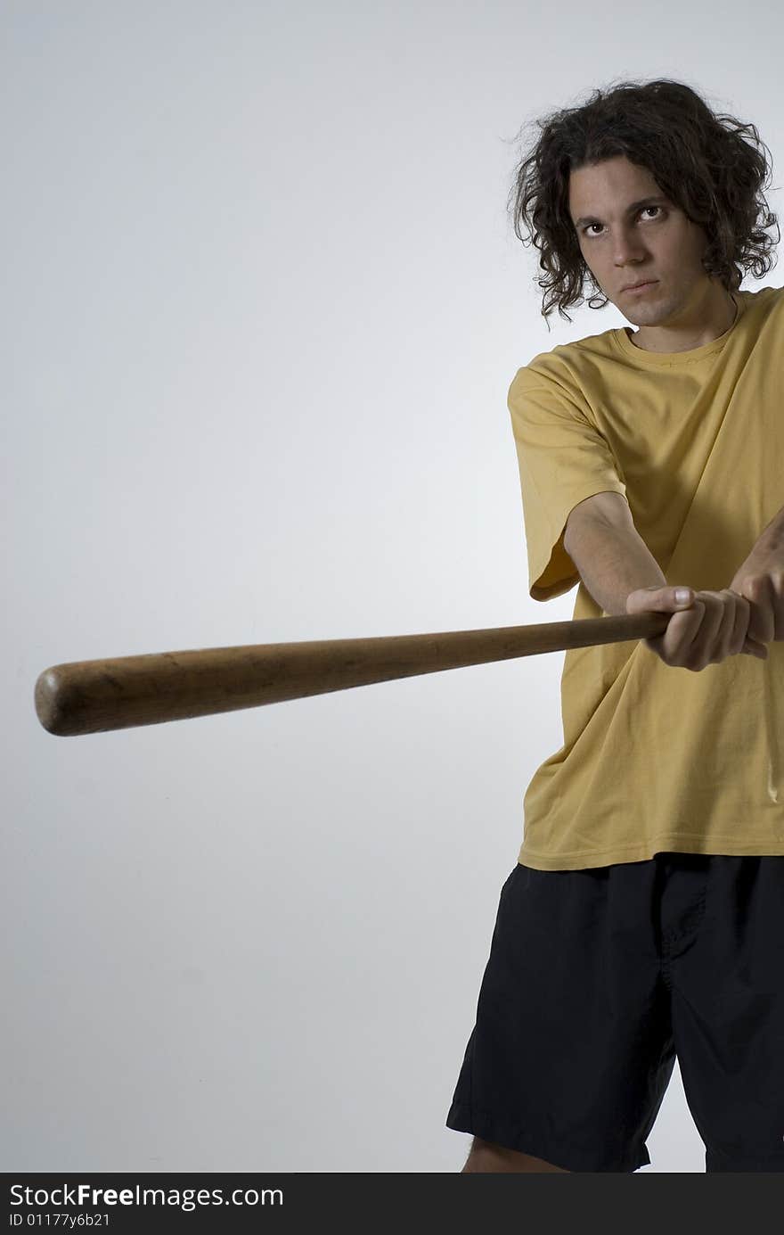 Man Swinging A Baseball Bat - Vertical