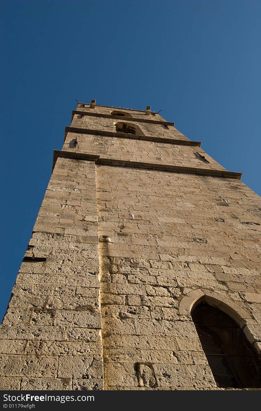 Medieval tower soaring into the blue sky