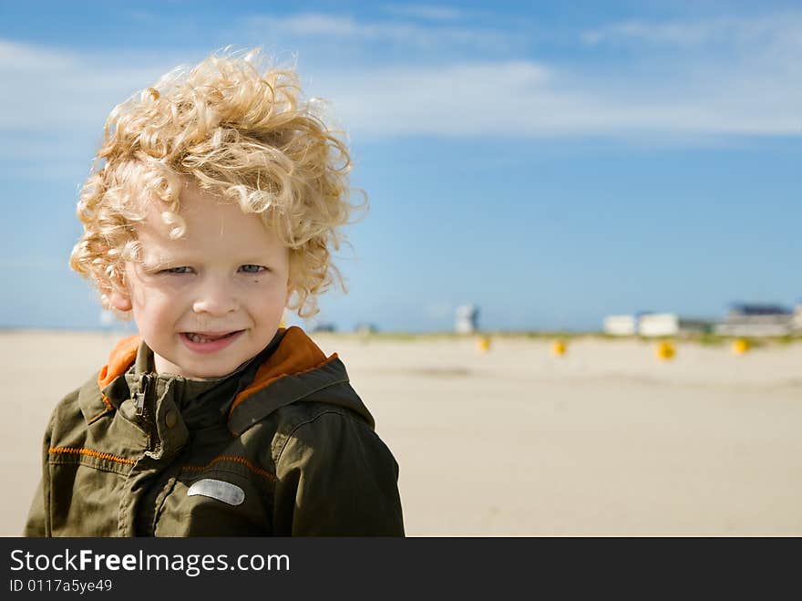 Cute Boy On The Beach