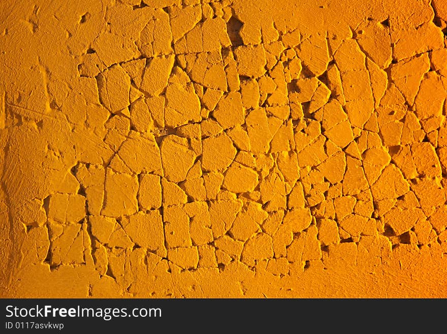 Close-up of orange eroded plaster