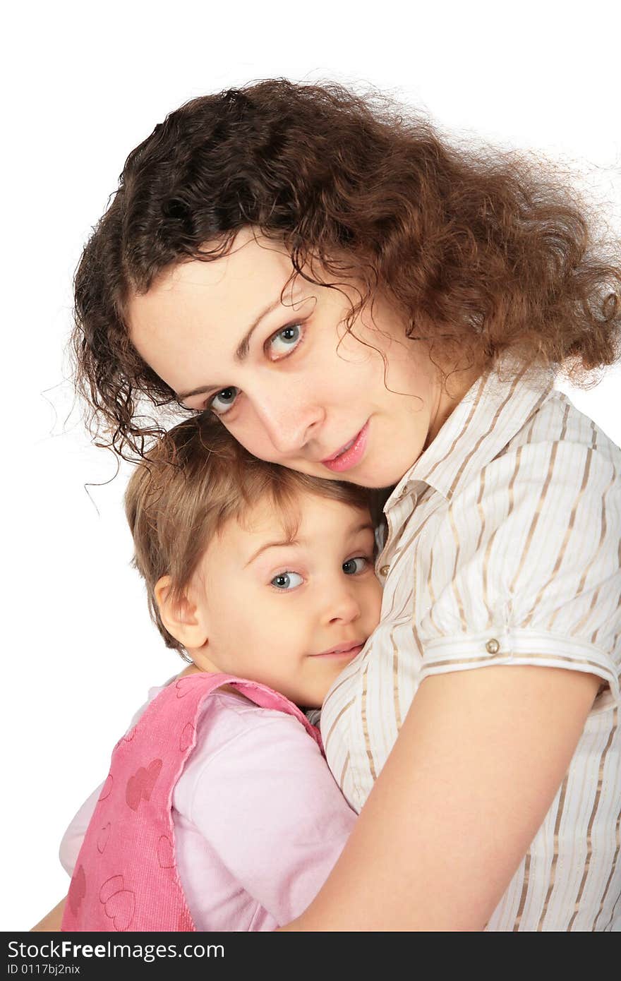 Girl embraces mother on white