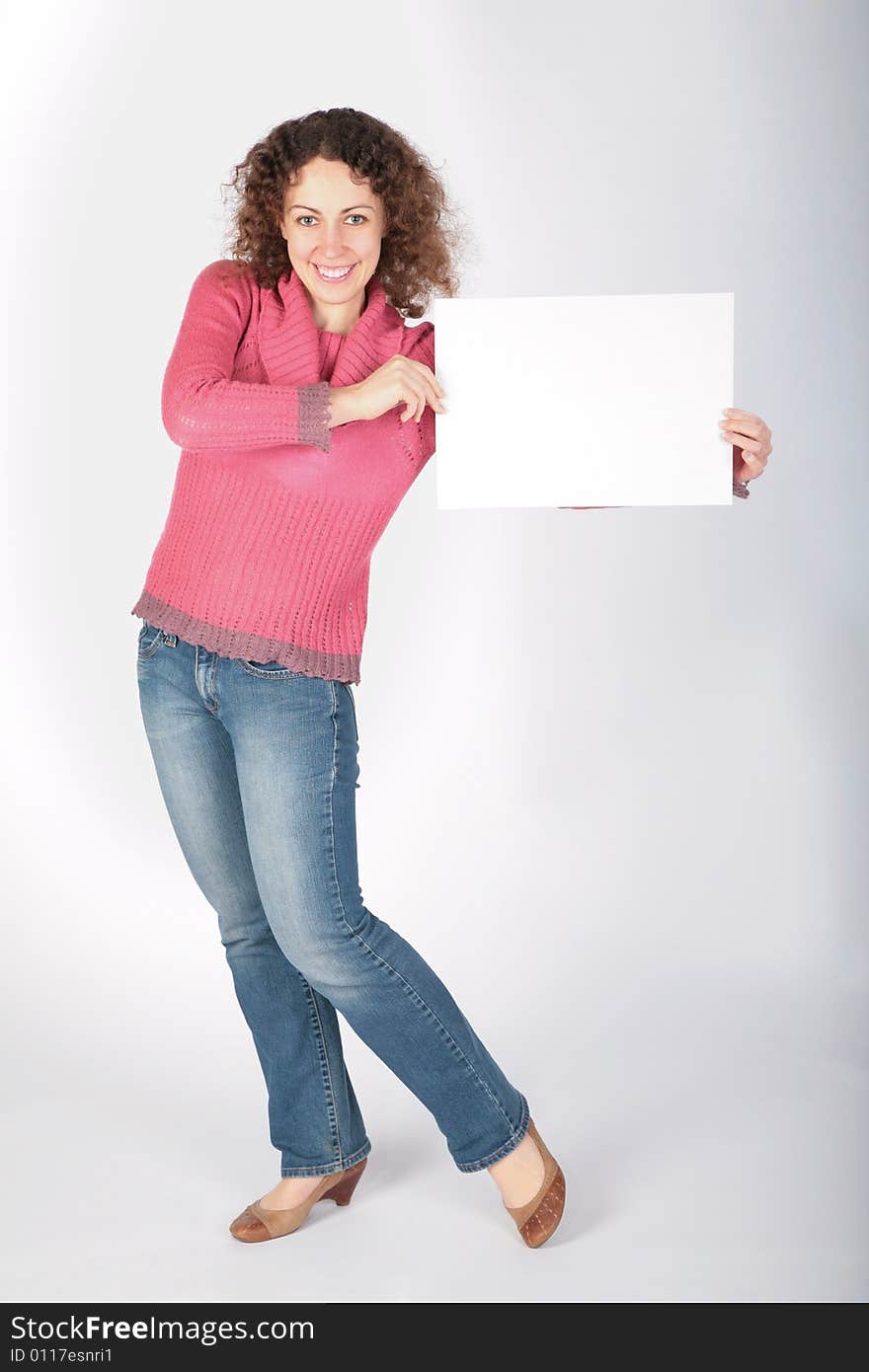 Young Woman Stands And Keep White Sheet