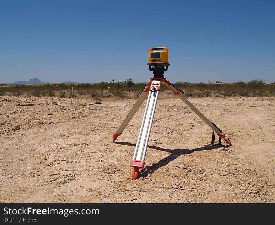 Man Surveying At Excavation Site - Horizontal