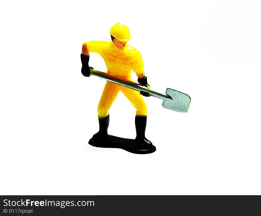 Small toy featuring a construction worker in action