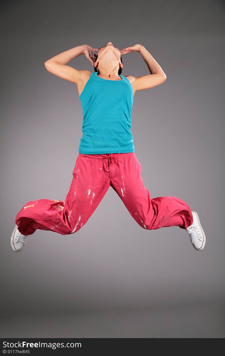 Woman in the sportswear in jump