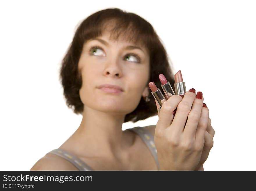 Woman choosing a lipstick