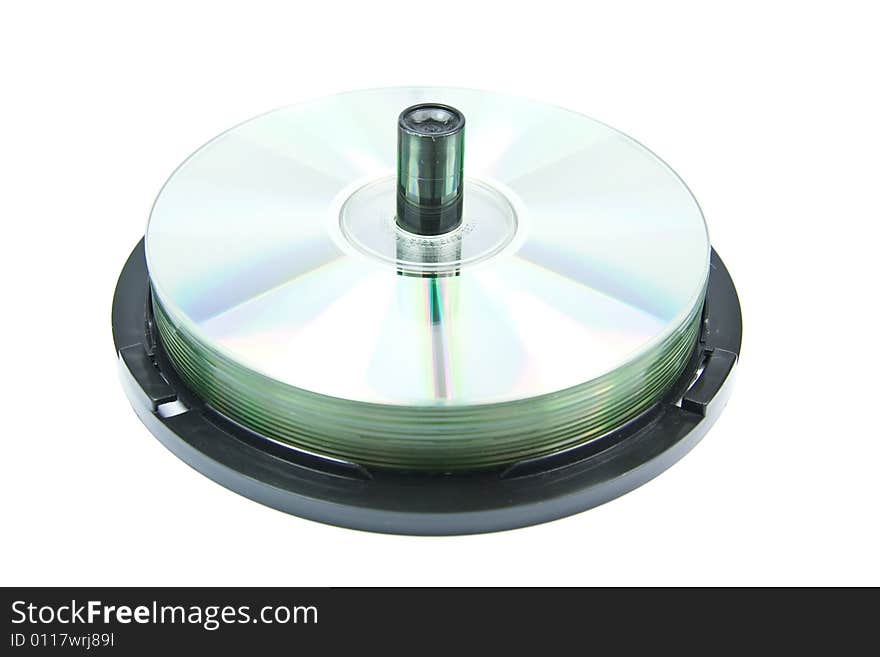 Colorful DVDs or CDs on spindle, on white background. No dust. Colorful DVDs or CDs on spindle, on white background. No dust.