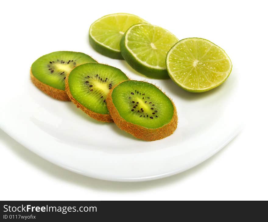 Sliced lime and kiwi on plate