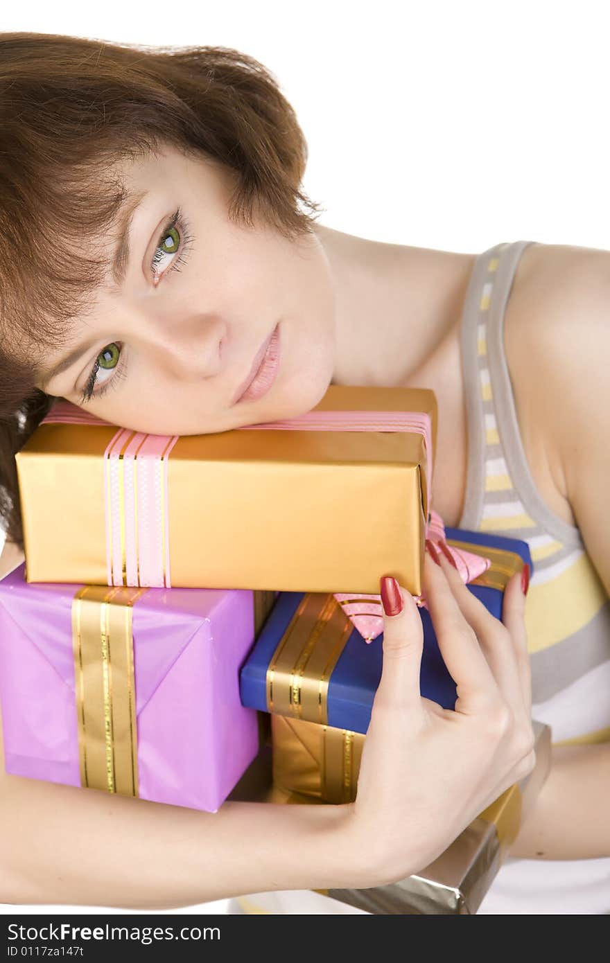 A close- up of sad girl with gifts over white