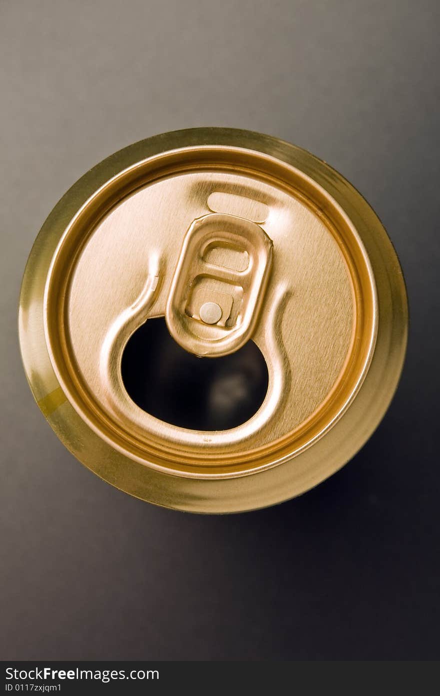 Aluminum  can of gold color costs on a grey background