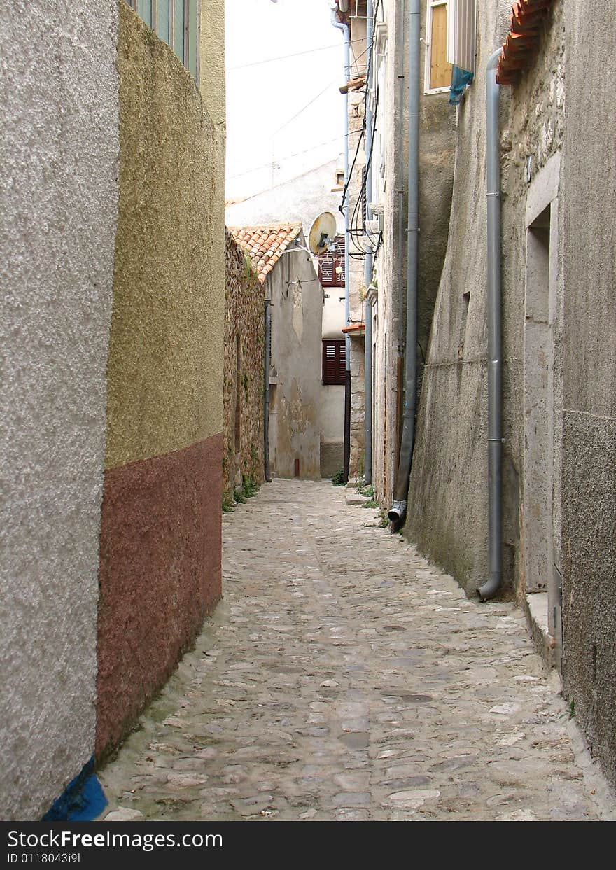 Narrow street in Krk town (Croatia)