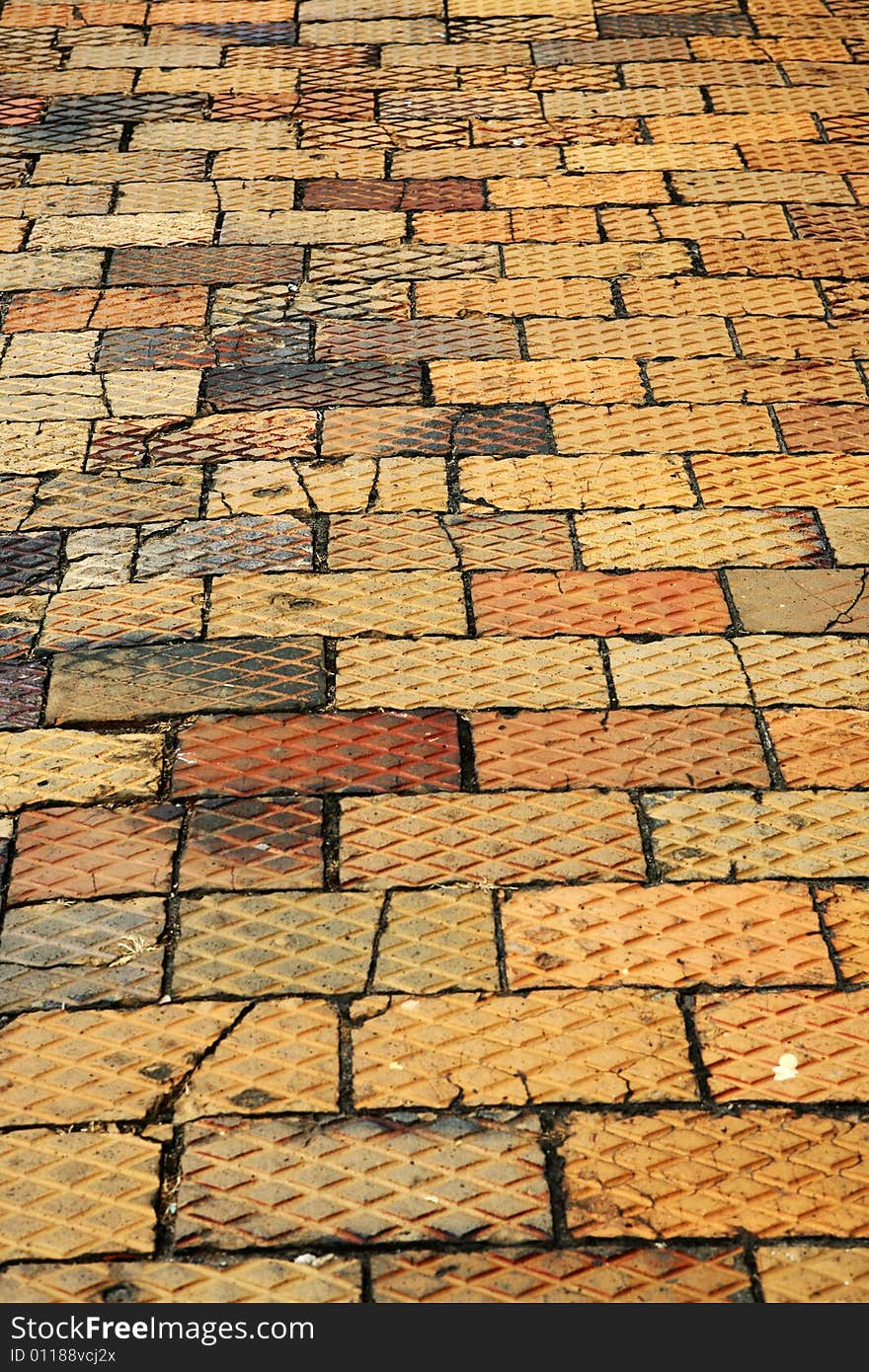 Pedestrian brick pavement in different colors with a pattern on top