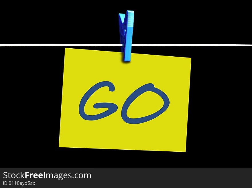 A yellow sticky handing on a line with peg depicting go online