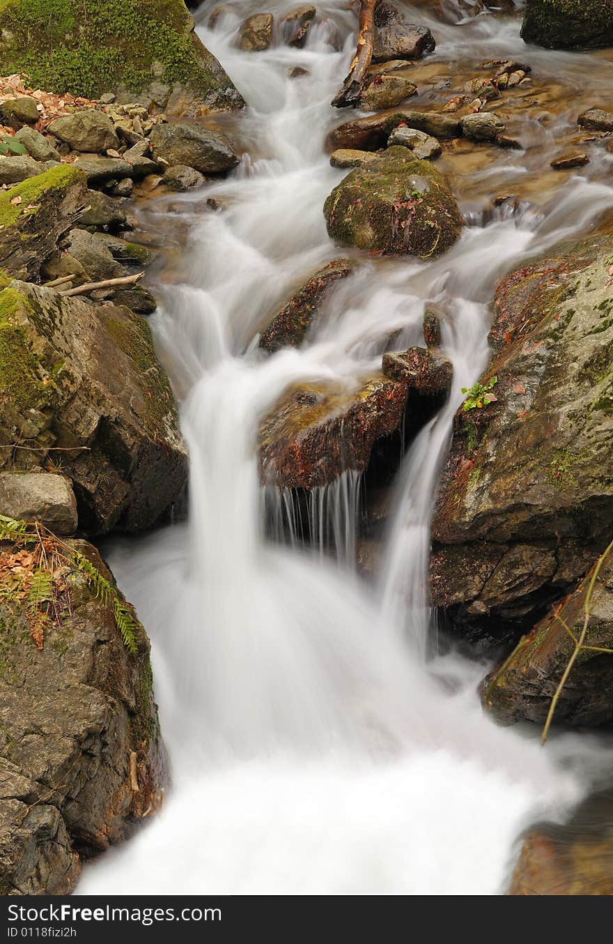 Long exposure shot of flowing water in the forest. Long exposure shot of flowing water in the forest