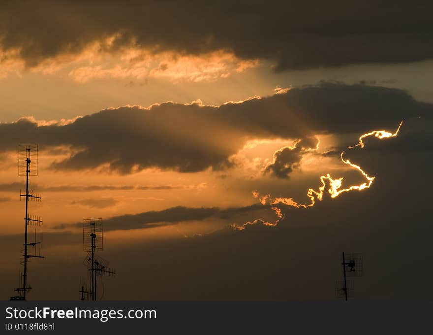 Antennas against sunset sky with clouds. Antennas against sunset sky with clouds