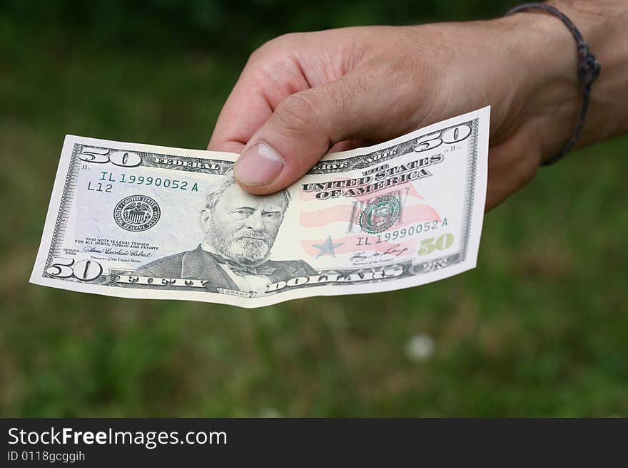 Hand with dollars