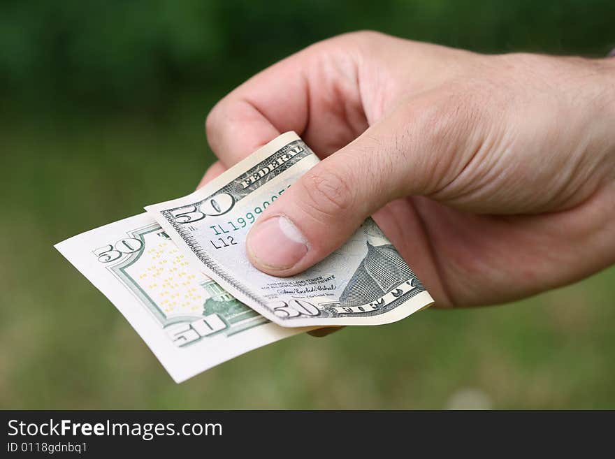 Man´s hand with fifty dollars. Man´s hand with fifty dollars