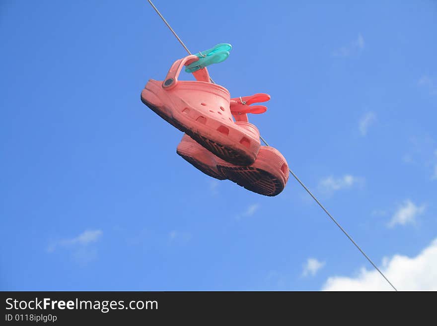 Dirty shoes on a washingline