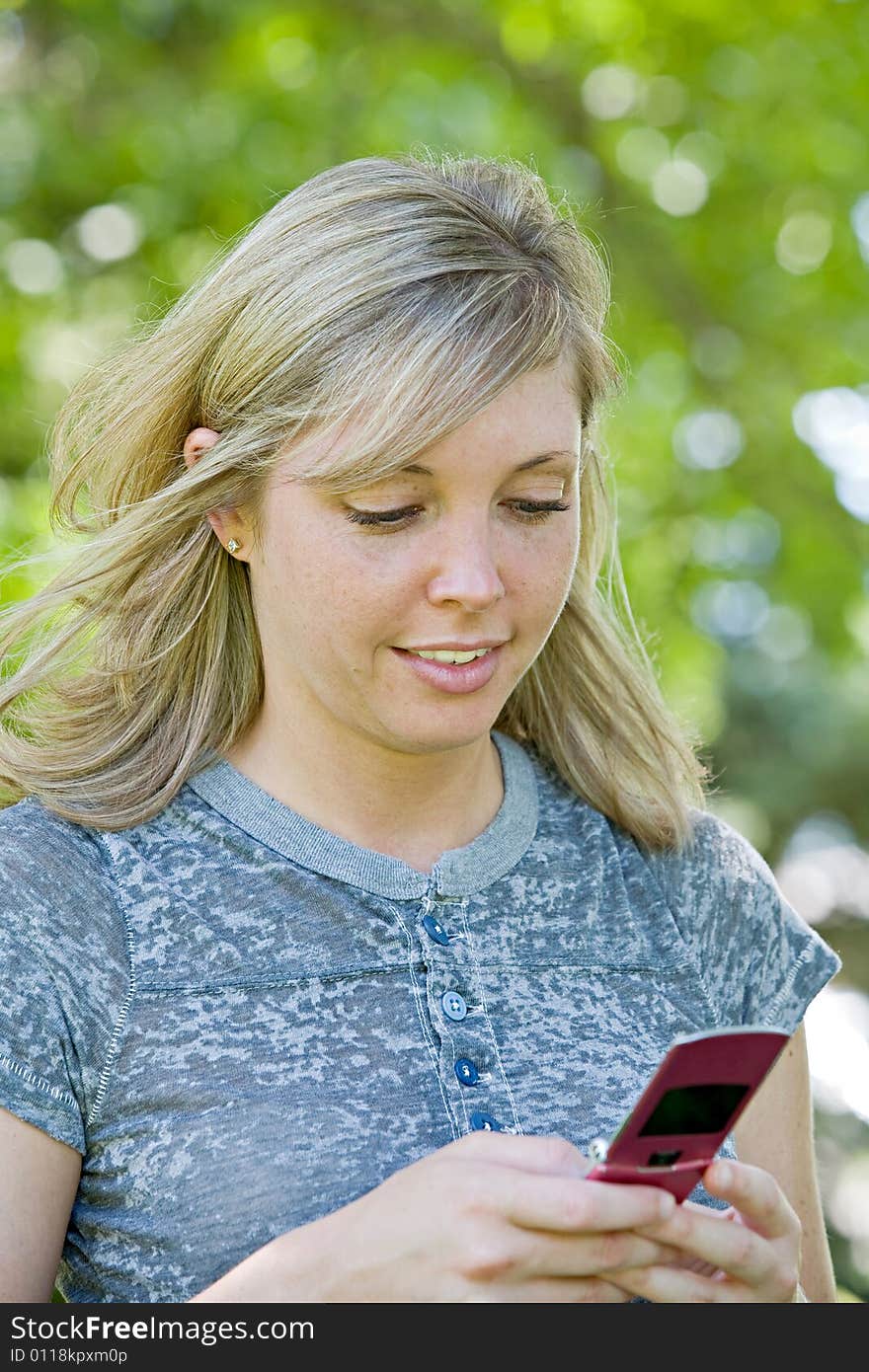 Young Girl Texting on Cell Phone