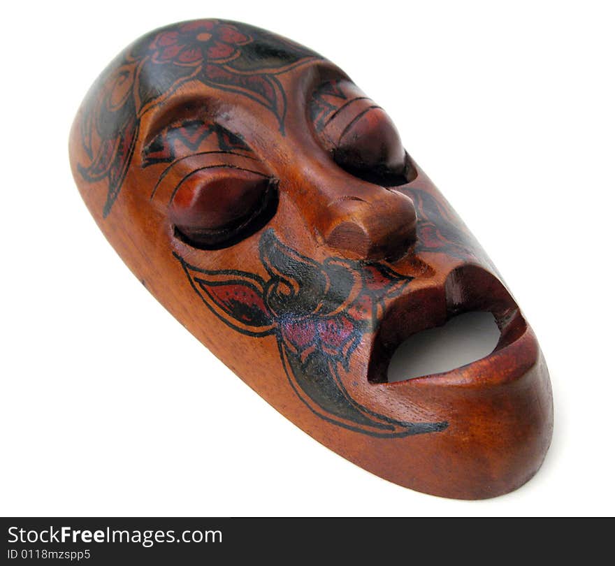 Carved wooden mask on white background