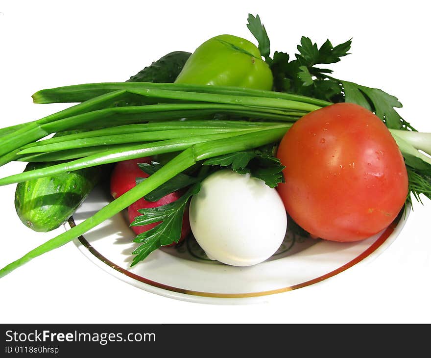 Vegetables and a hard-boiled egg on a plate. Vegetables and a hard-boiled egg on a plate