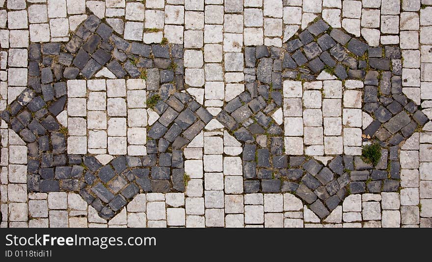 Prague sidewalk with star symbol. Background texture.