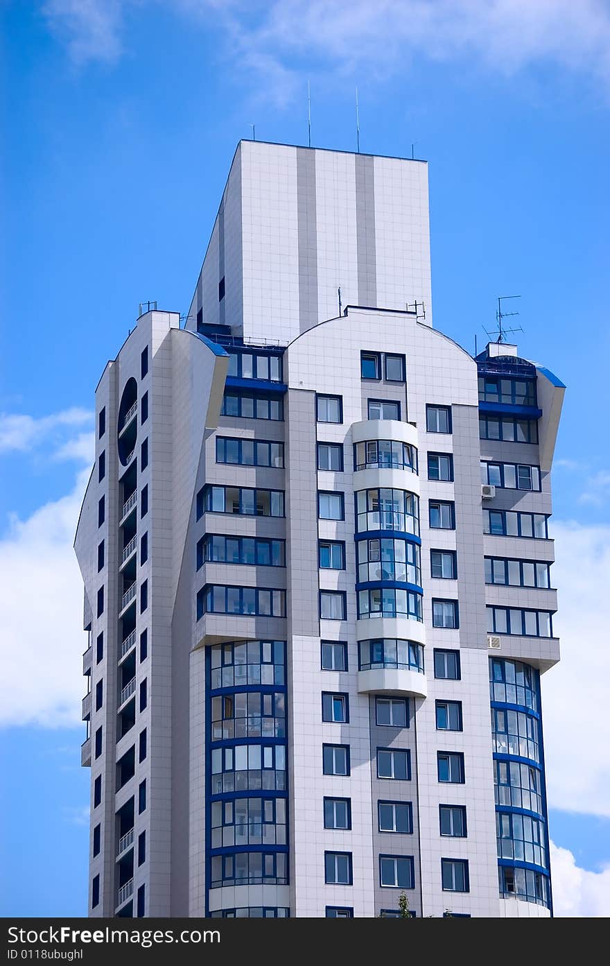 Modern office building on blue sky background