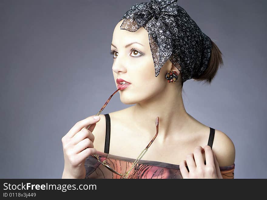 Glamour portrait of beautiful woman with glasses