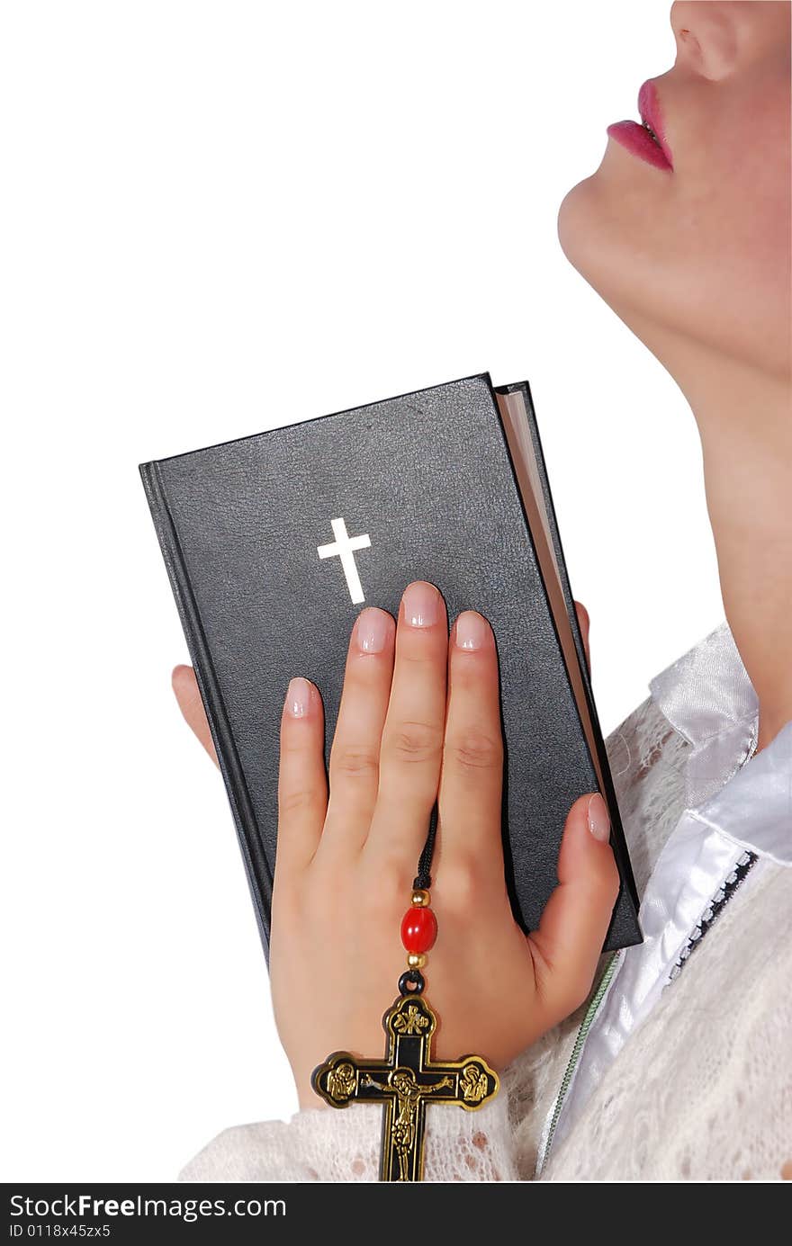 Woman praying with a bible in hands isolated on white background,check also Religion. Woman praying with a bible in hands isolated on white background,check also Religion