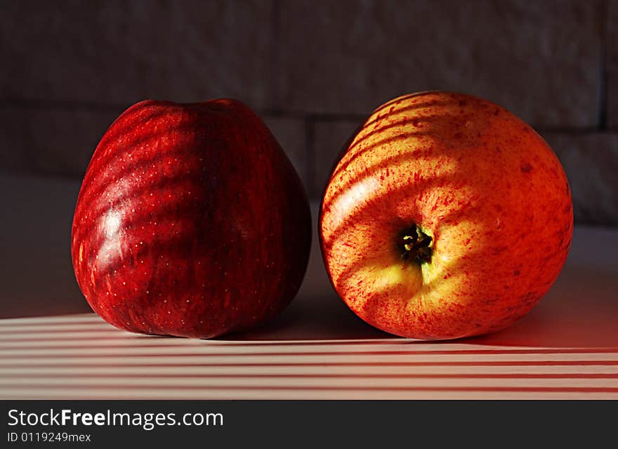 Two apples on a sunlight