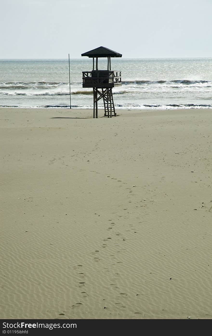 Beach detail with lifeguard cabin.