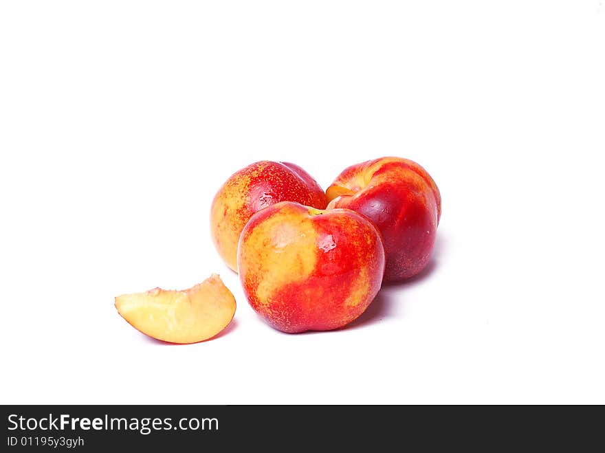 Three juicy peaches isolated on white background