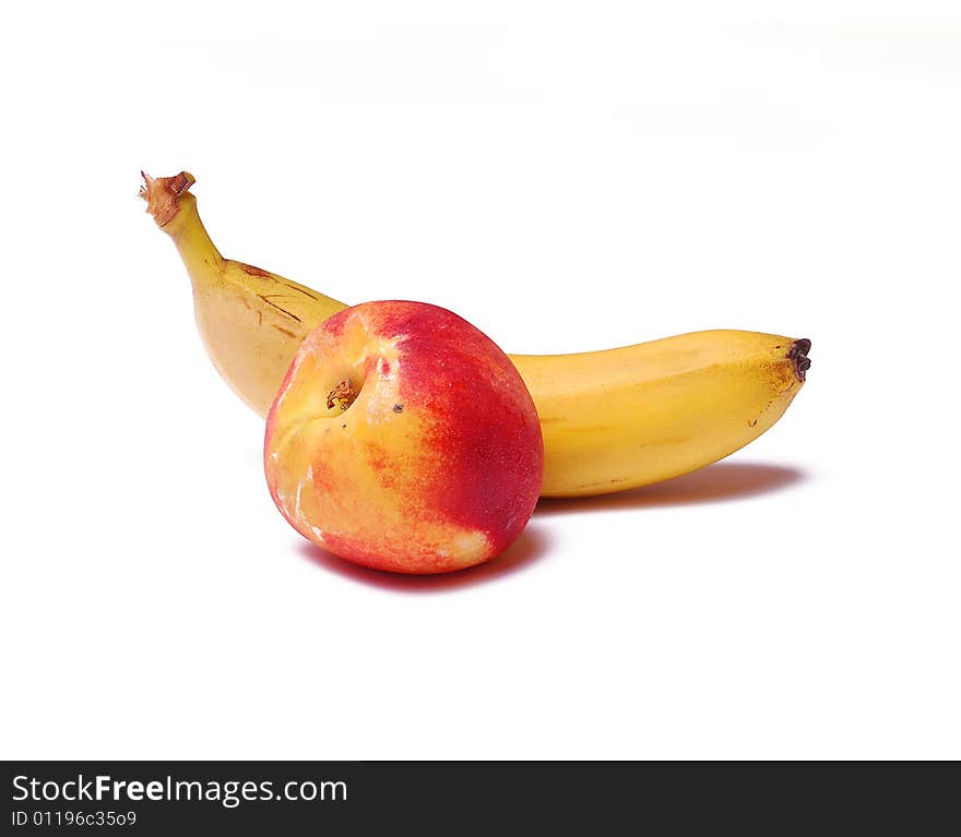 Banana and peach isolated on white background