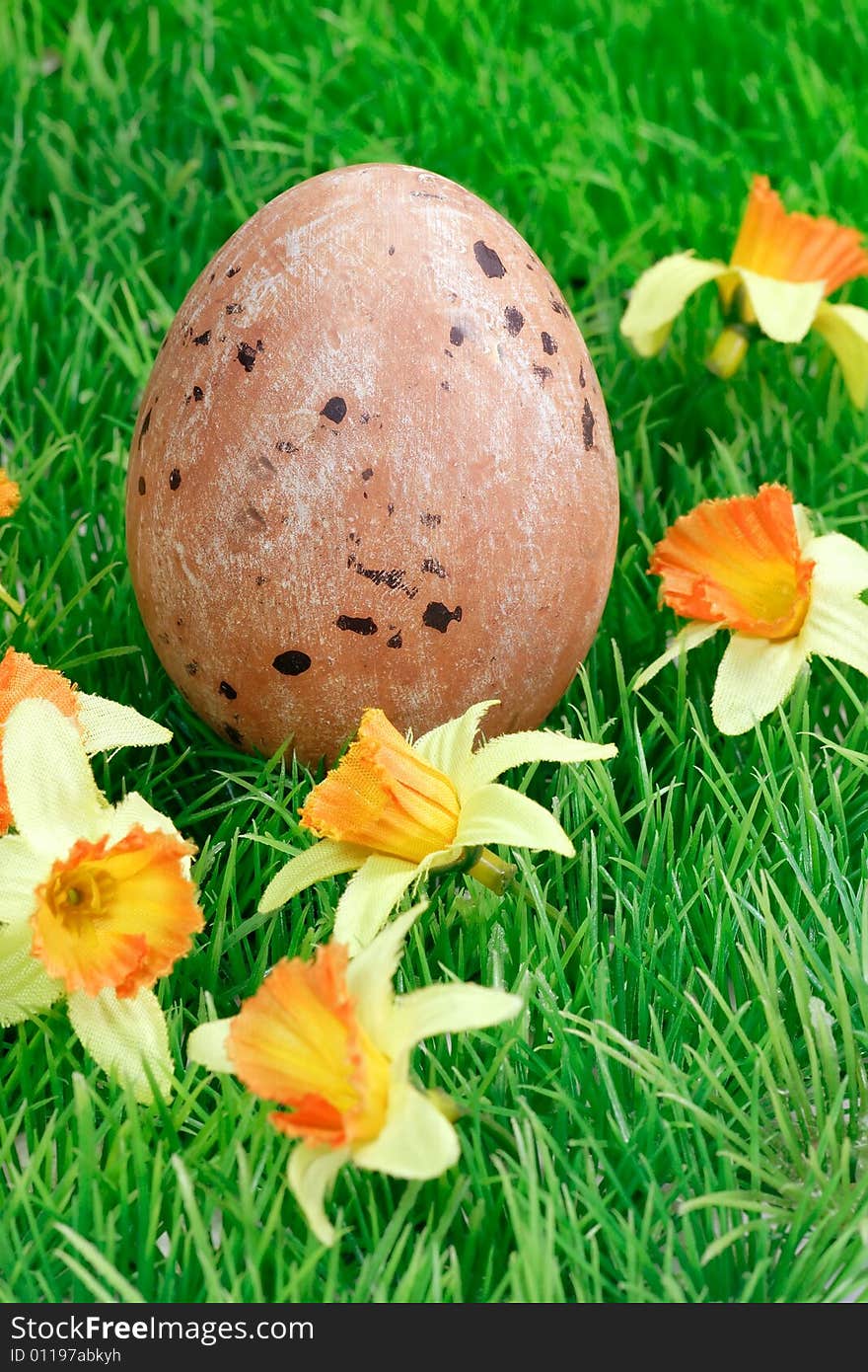 Easter decoration on green grass with flowers. Easter decoration on green grass with flowers