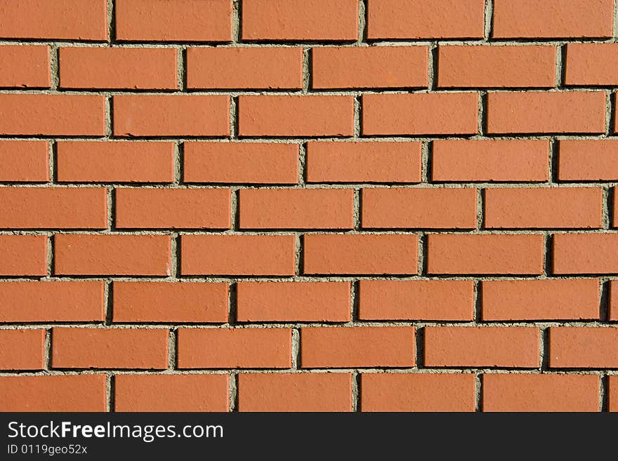 Modern brick wall background shot in direct sunlight