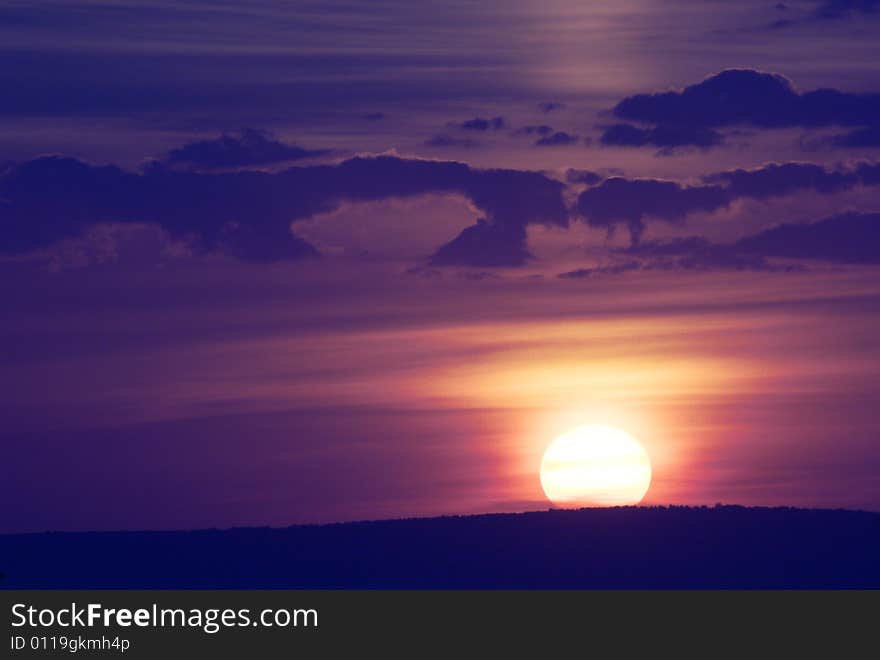 Photo of a sunset sky. The image can be applied as a background.