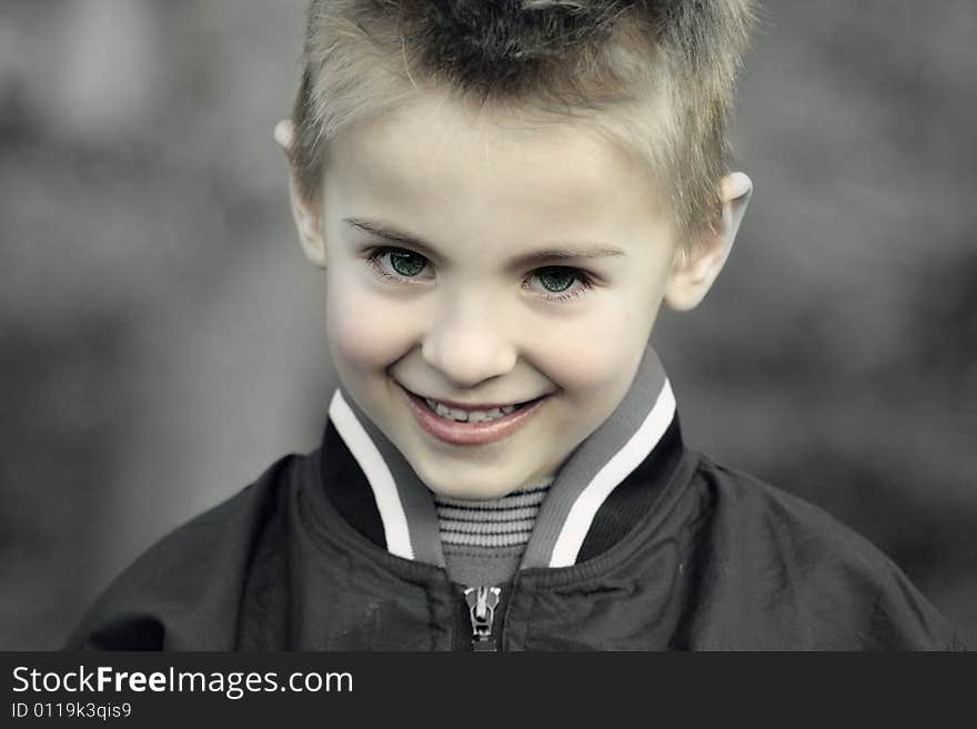 Happy smiling innocent child with chubby cheeks and perfect blue eyes. Happy smiling innocent child with chubby cheeks and perfect blue eyes