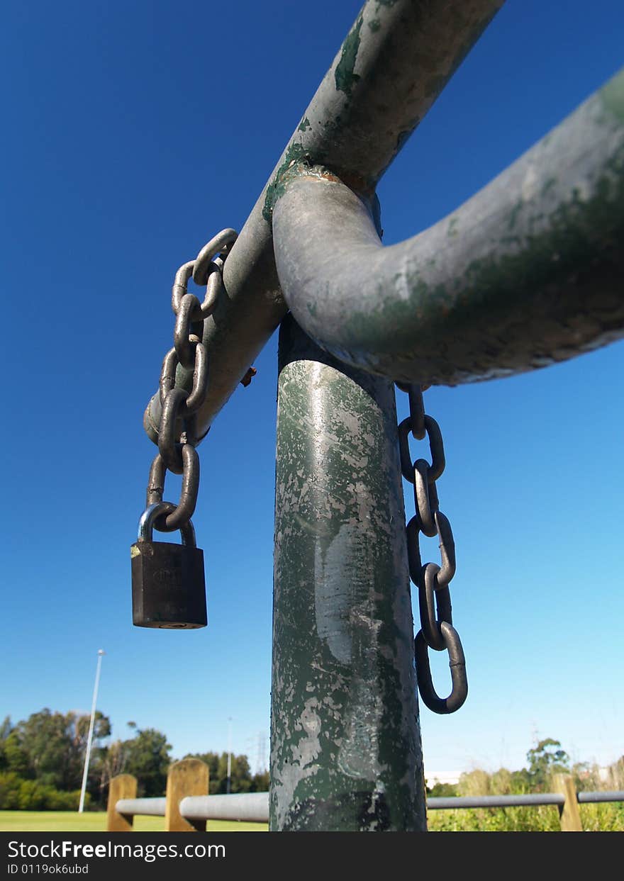 Chain and padlock on iron gate