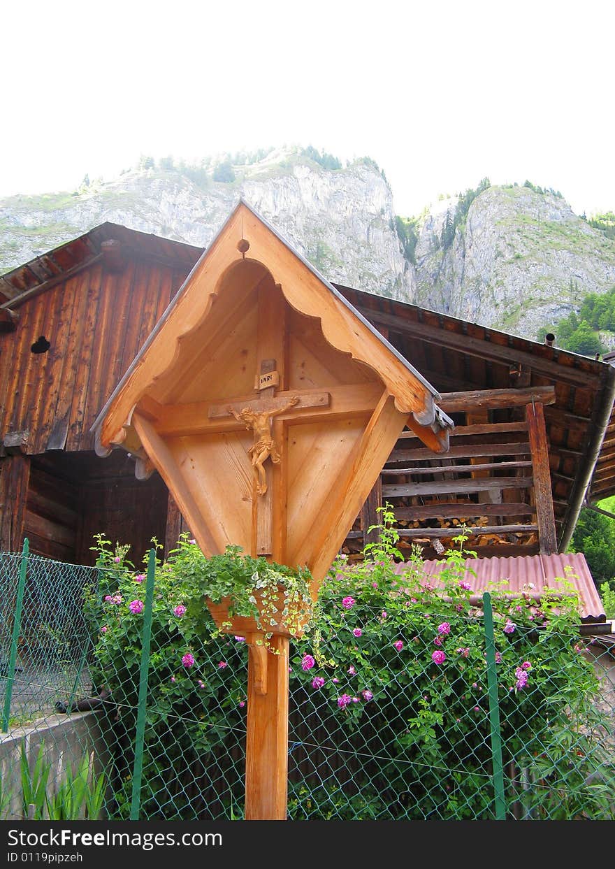 A tiny chapel among the treescrucifix in the dolomites. A tiny chapel among the treescrucifix in the dolomites