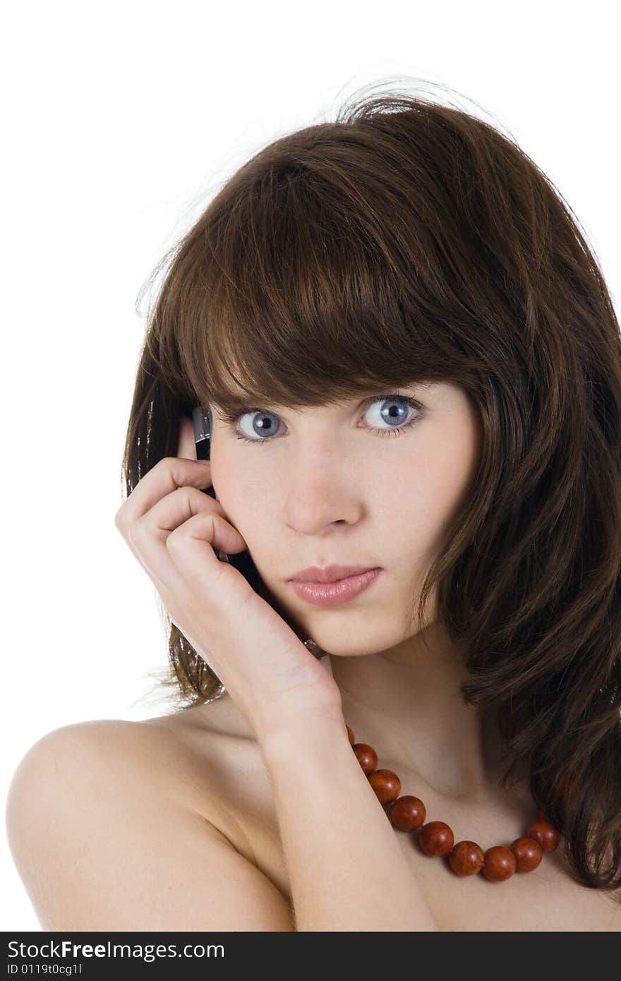 Young woman in the red chequiered dress speaking by cellular phone. Young woman in the red chequiered dress speaking by cellular phone