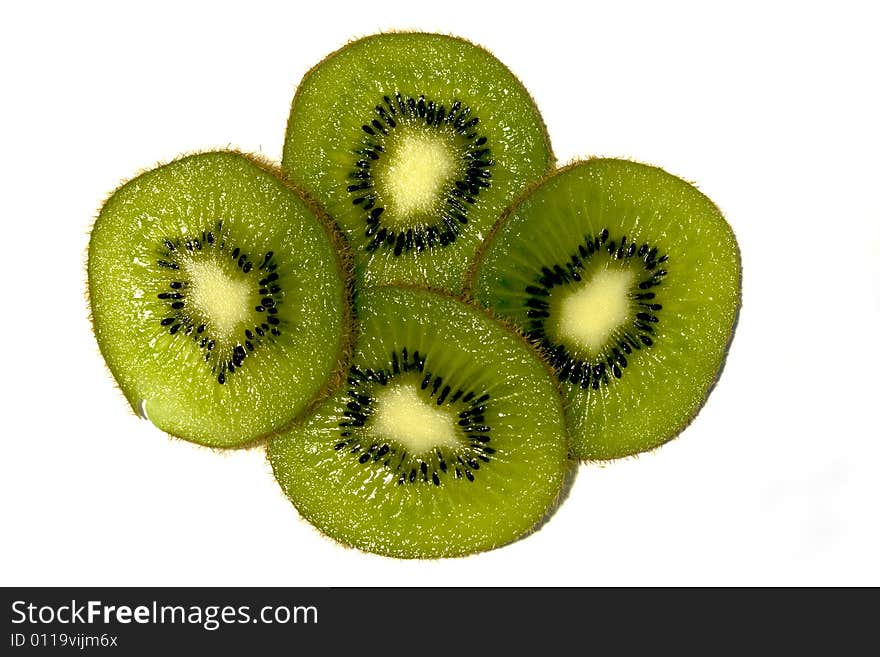 Four kiwi fruit slices on white background. Four kiwi fruit slices on white background