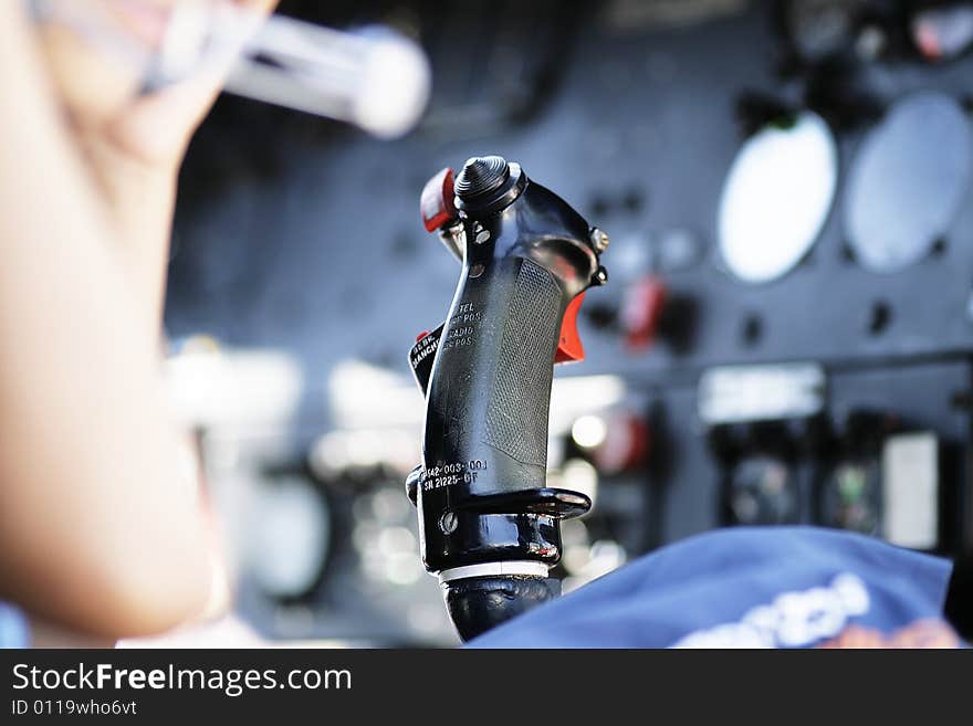 close up of a joystick controller at the main board of an airplane