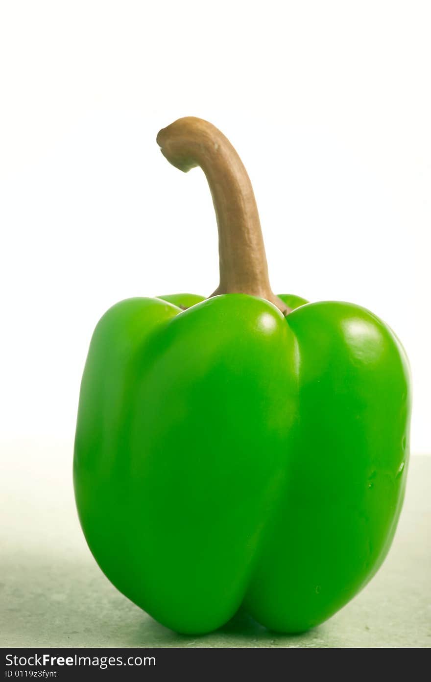 Green pepper on white background