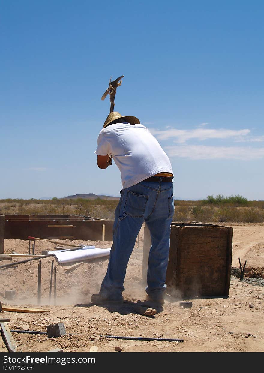 Man Working on Excavation Site - Vertical