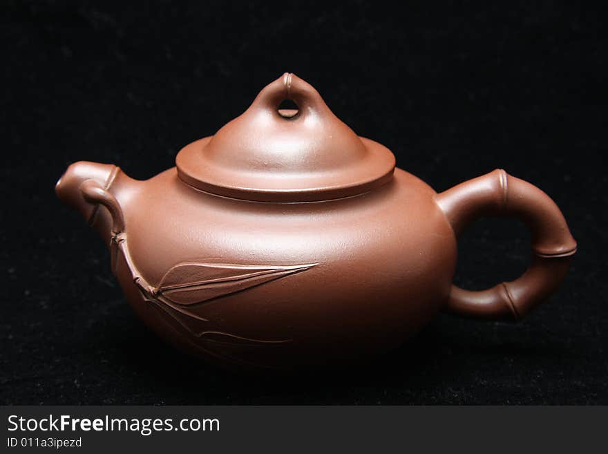 My teapot isolated on black background,also called zisha teapot in China.